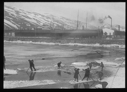 Image of Men on ice floes, pushing with poles